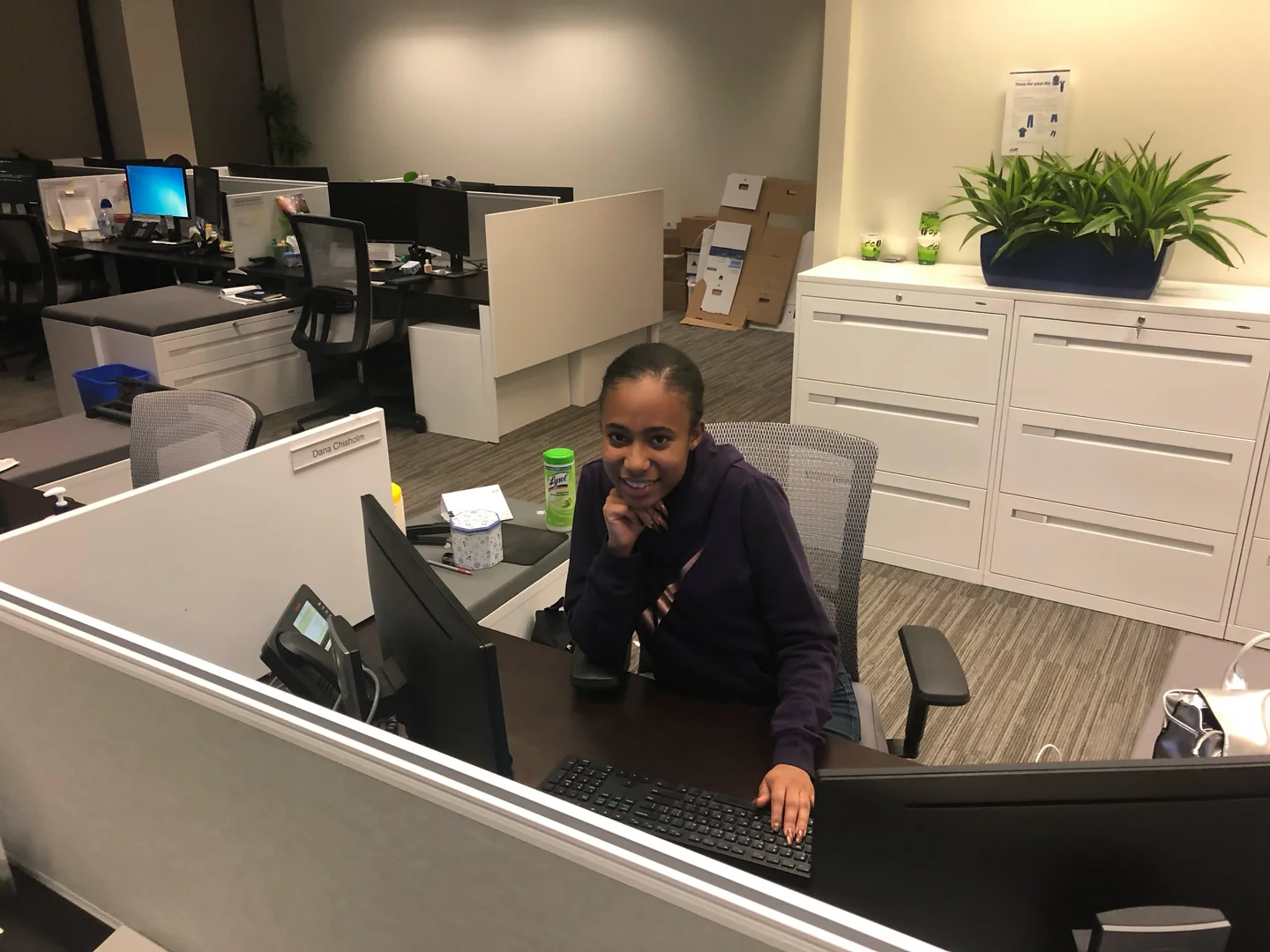 Dana at her desk in a corporate office