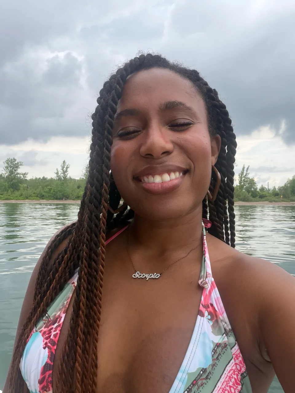 Dana Chisholm outdoors by the water